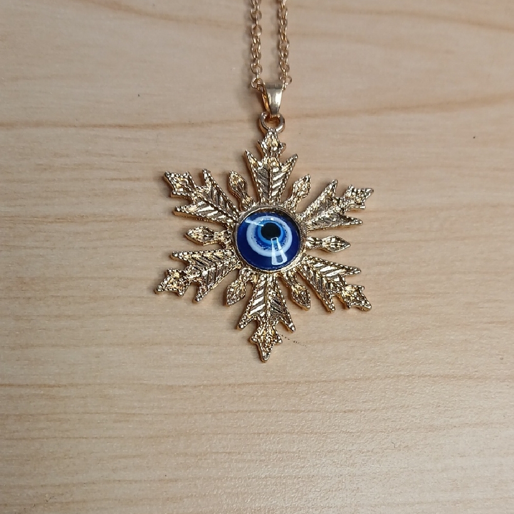 Gold Toned and Blue Snowflake Evil Eye Pendant Necklace
